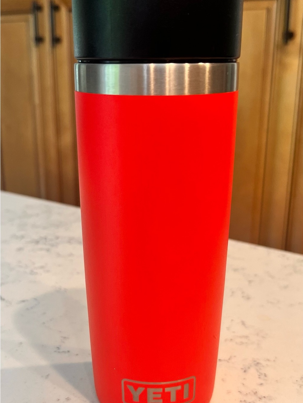 Yeti insulated tumbler in bright red with black lid